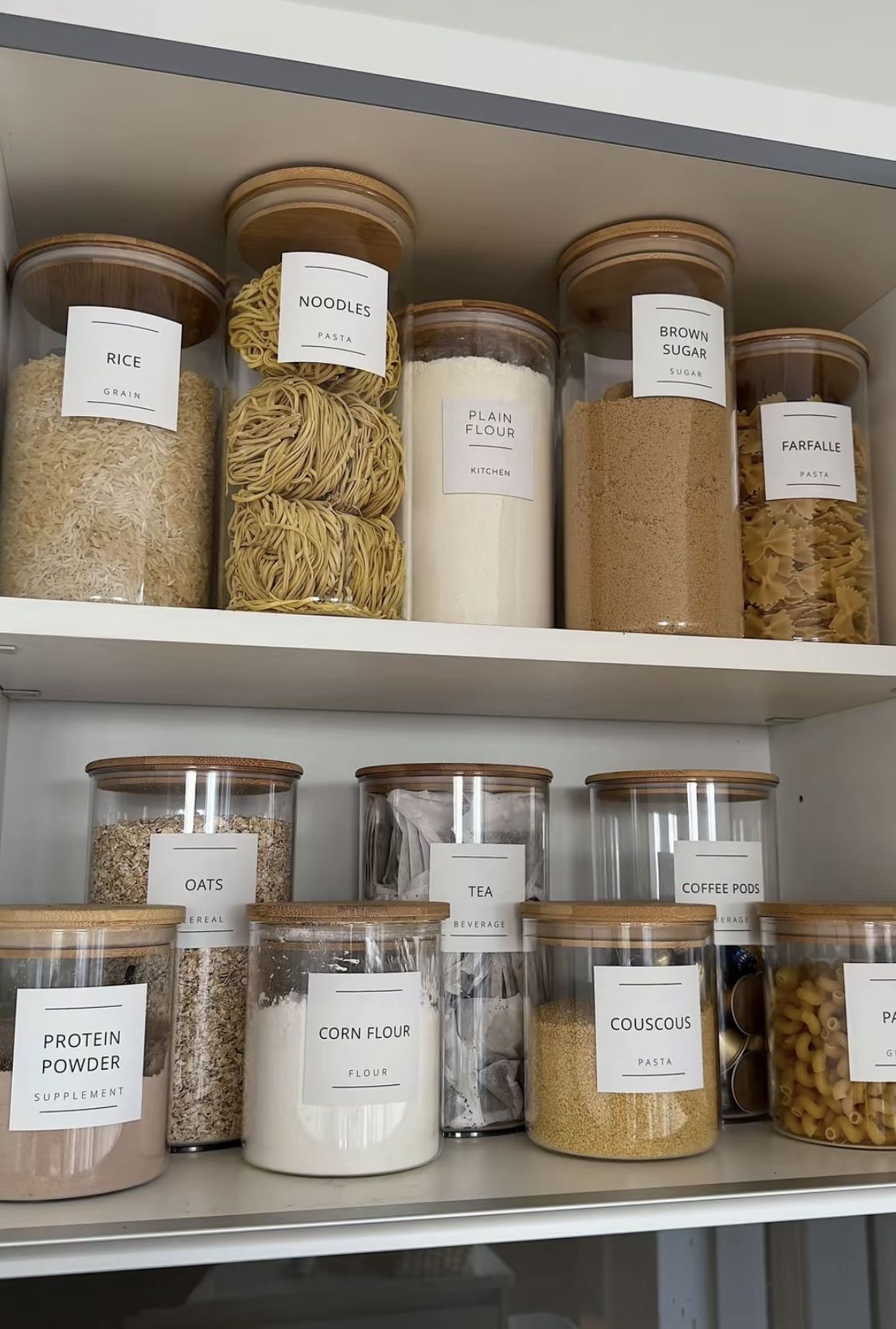 Kitchen pantry with labelled glass jars for dry goods